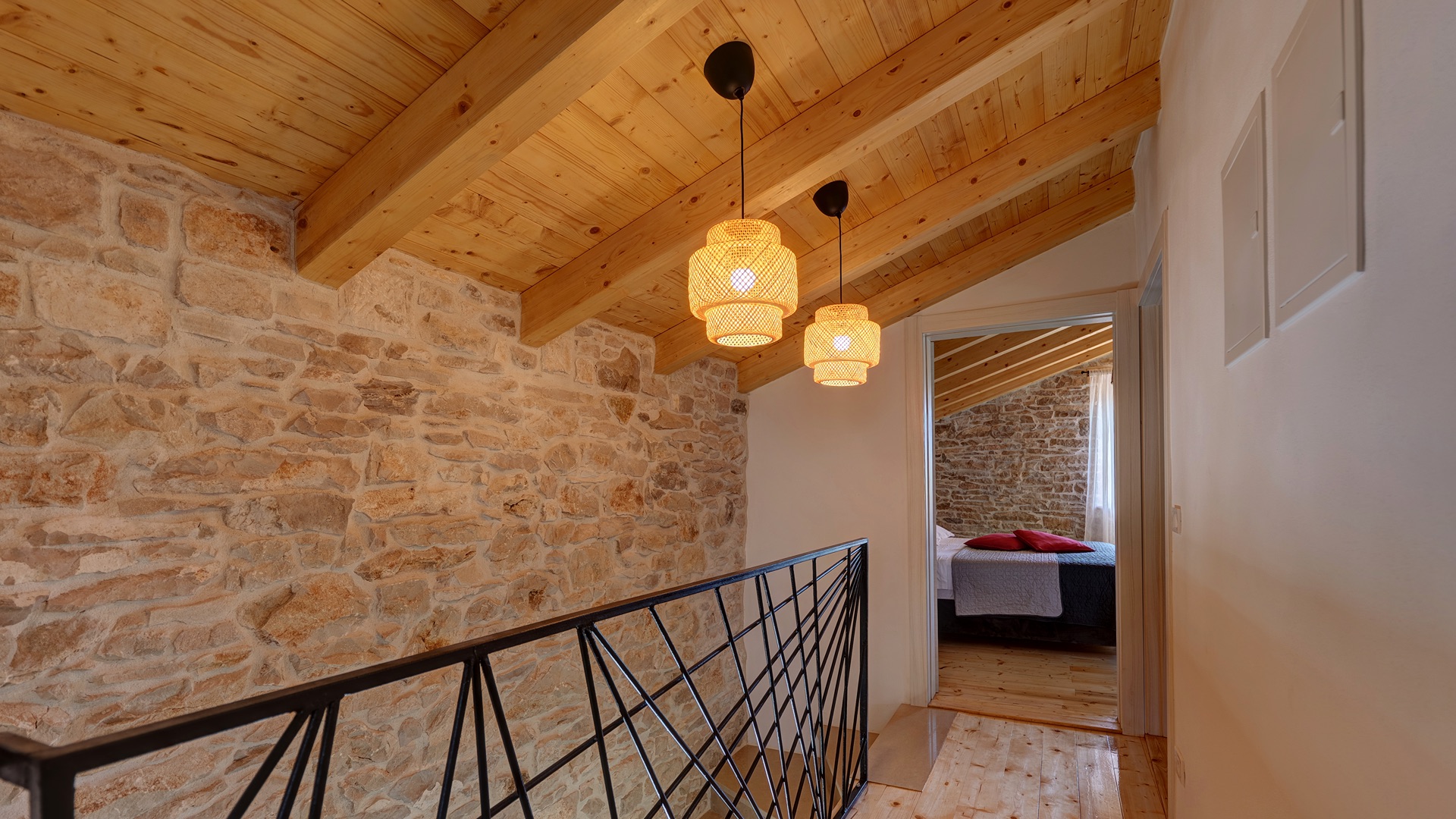 Hallway view to bedroom — rattan pendants
