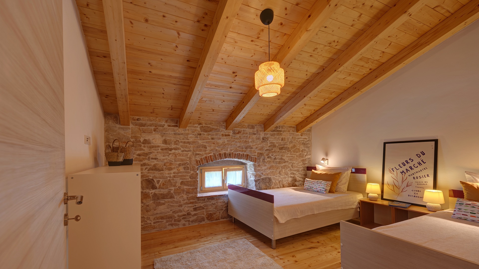 Bedroom 3 — twin beds with stone wall