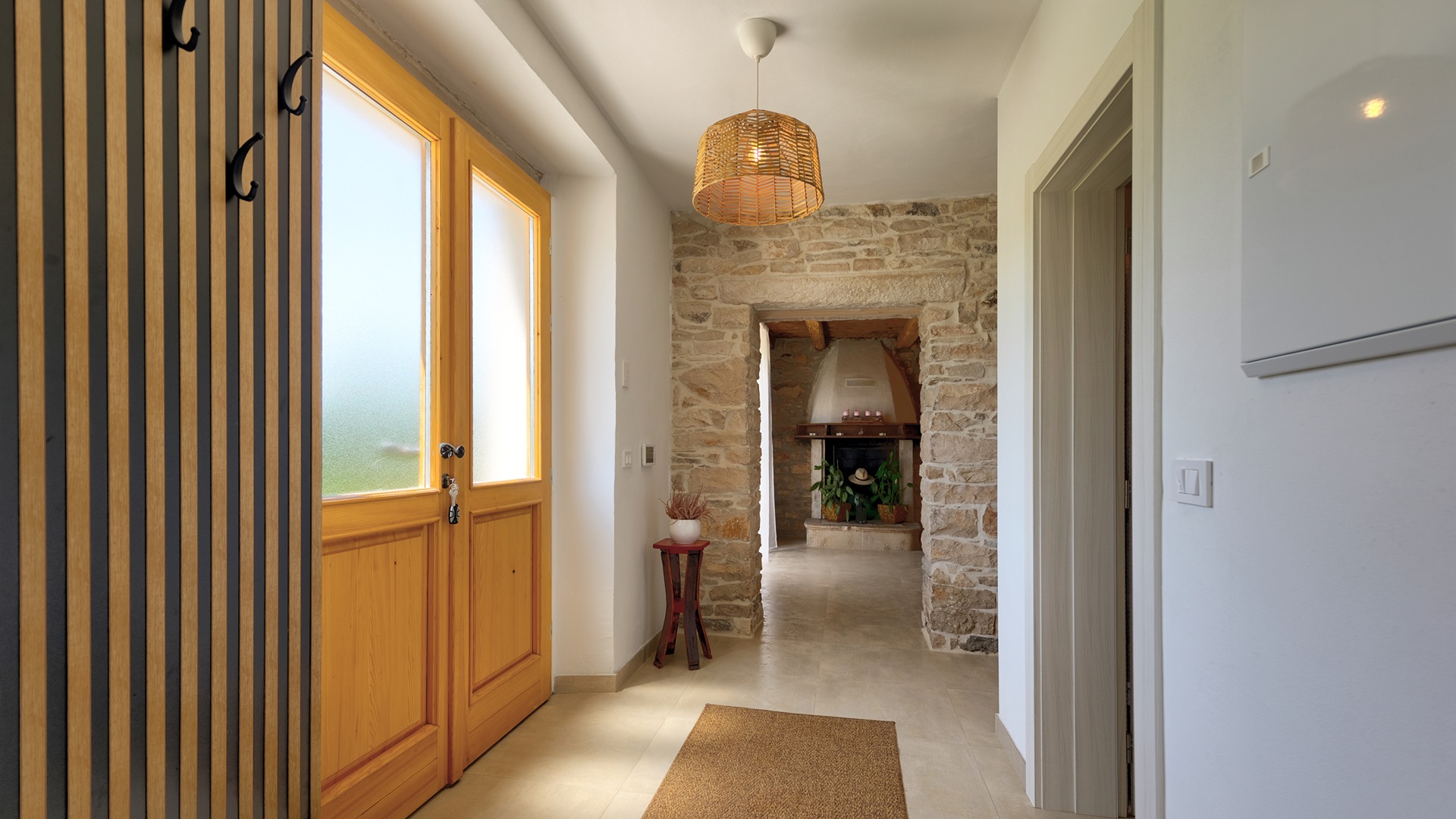 Entrance hall from inside — door & stone