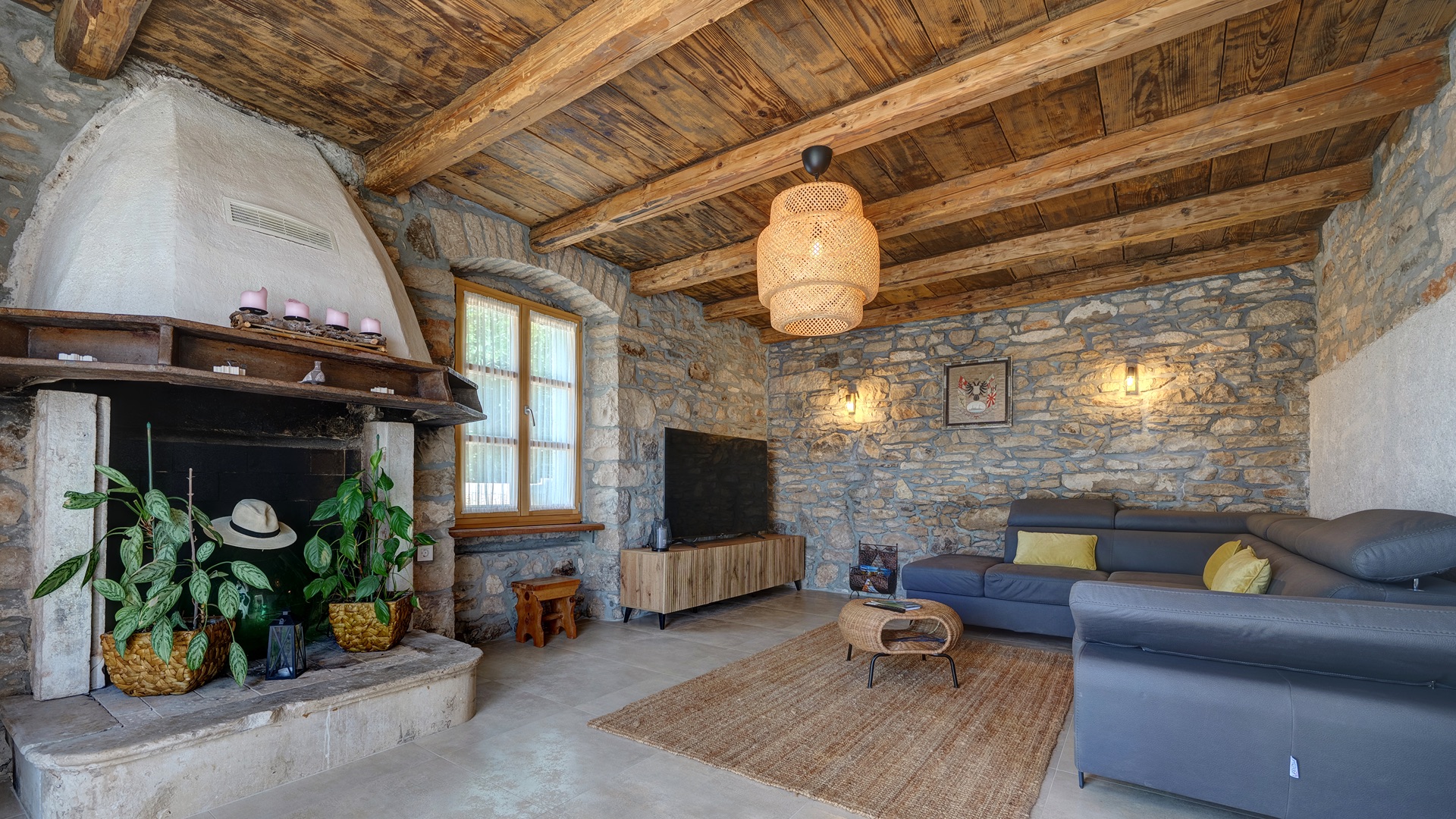 Living room — stone fireplace & wooden beams
