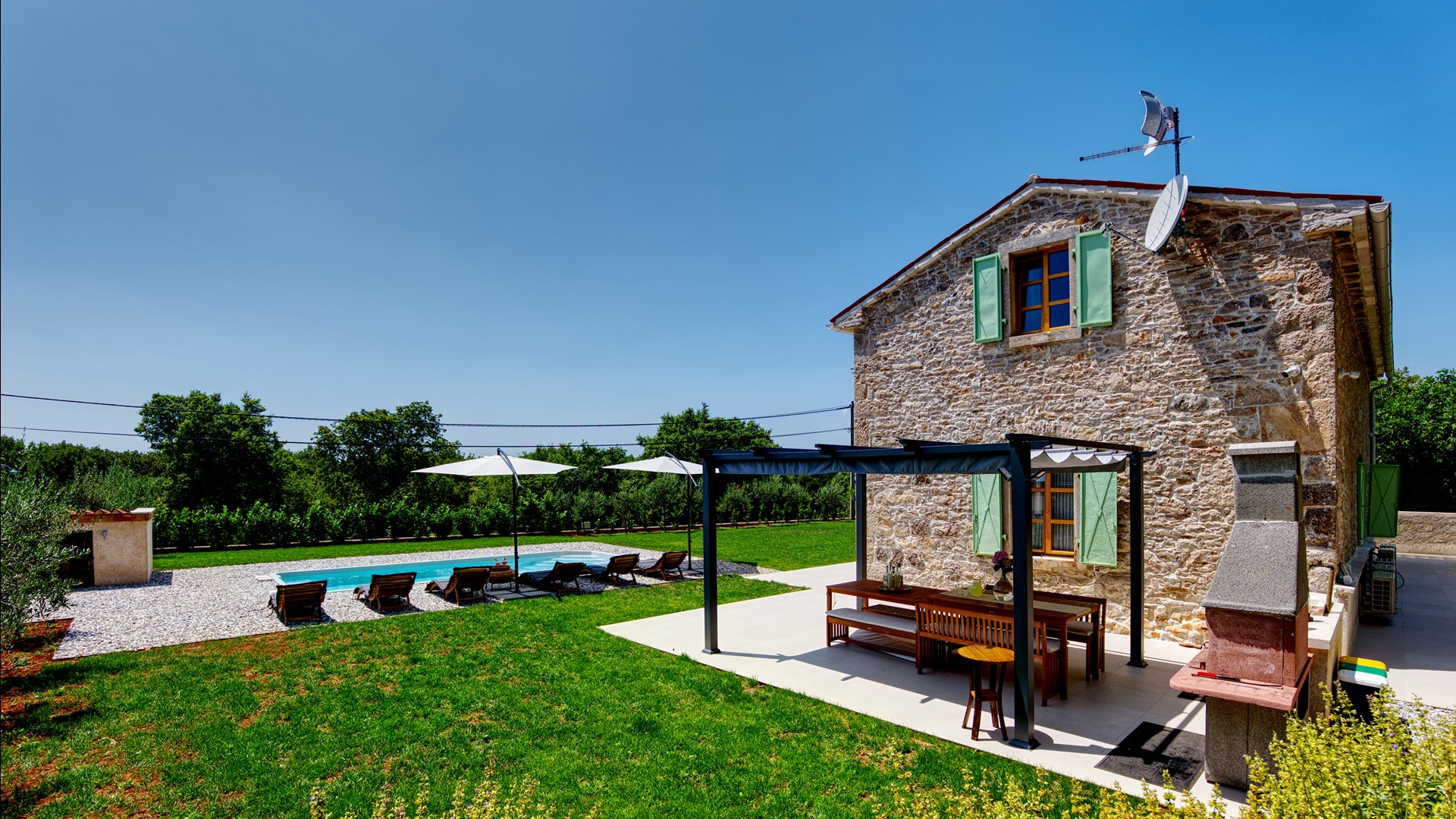 Outdoor stone kitchen & terrace dining