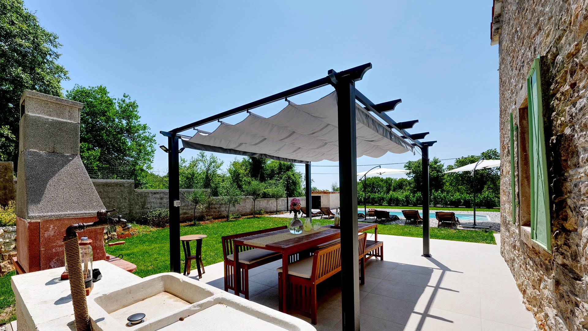 Pergola dining — pool view