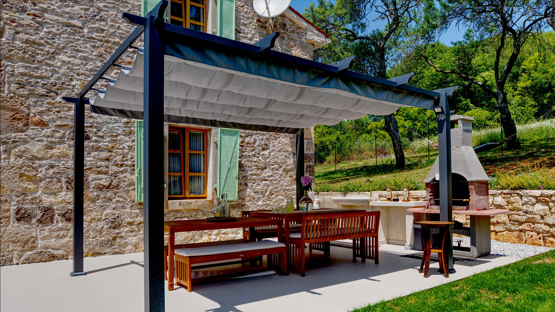 Pergola & outdoor kitchen with stone BBQ